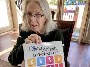 Resident playing chair activity bingo
